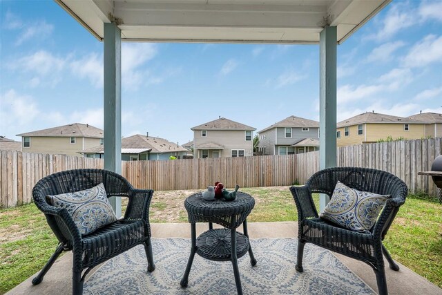 221 Pearl Way, Buda, TX 78610 - fenced backyard with a residential view and a patio