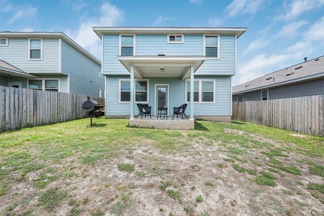 221 Pearl Way, Buda, TX 78610 - rear view of property featuring a patio and a fenced backyard