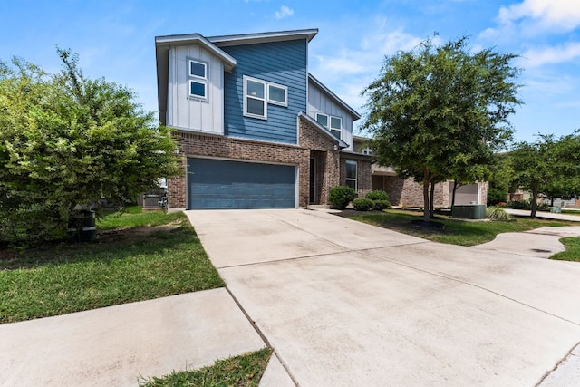 3800 Bristol Motor Pass, Austin, TX 78728 - view of front of house featuring brick siding, driveway, and an attached garage
