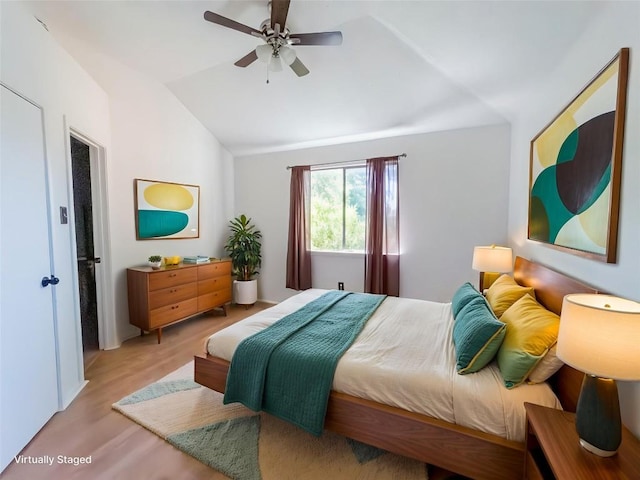823 Topaz Ln, Leander, TX 78641 - bedroom featuring lofted ceiling, wood finished floors, and a ceiling fan