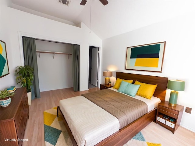 823 Topaz Ln, Leander, TX 78641 - bedroom featuring a closet, lofted ceiling, light wood finished floors, and ceiling fan