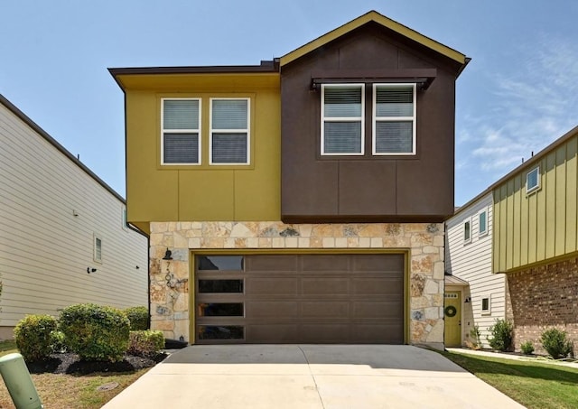 7506 Chesapeake Rail Ln, Austin, TX 78744 - view of front of home with stone siding, a garage, and concrete driveway