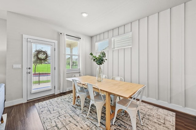 7506 Chesapeake Rail Ln, Austin, TX 78744 - dining area with dark wood-style flooring and baseboards