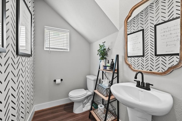 7506 Chesapeake Rail Ln, Austin, TX 78744 - half bathroom featuring wood finished floors and vaulted ceiling