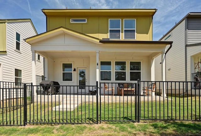 7506 Chesapeake Rail Ln, Austin, TX 78744 - back of house featuring a porch and a fenced front yard