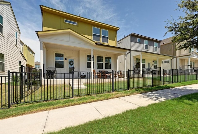 7506 Chesapeake Rail Ln, Austin, TX 78744 - view of front of home featuring a porch, a fenced front yard, and stucco siding