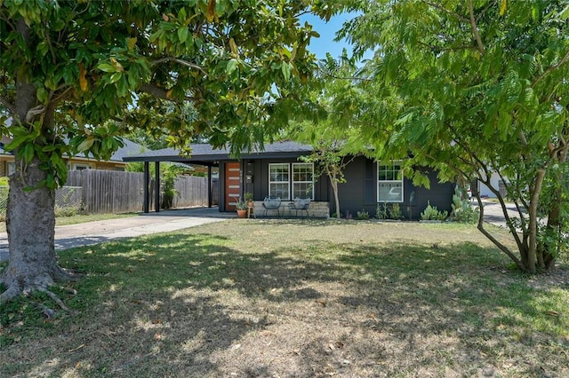 8415 Bowling Green Dr, Austin, TX 78757 - view of front of house featuring concrete driveway and an attached carport