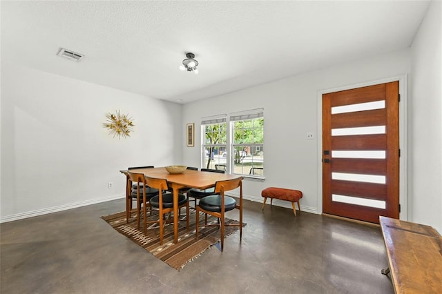 8415 Bowling Green Dr, Austin, TX 78757 - dining space featuring concrete floors