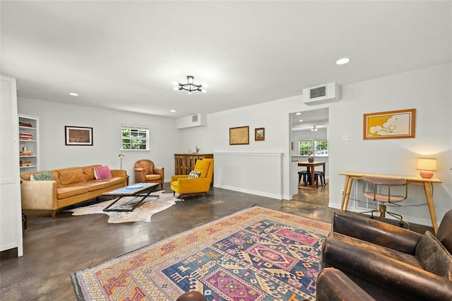 8415 Bowling Green Dr, Austin, TX 78757 - living area with concrete floors, healthy amount of natural light, and recessed lighting