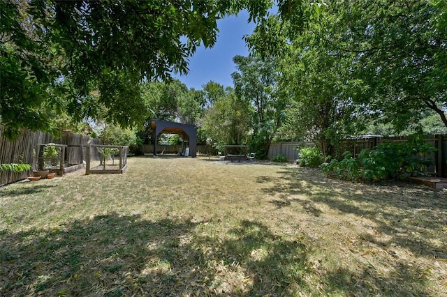 8415 Bowling Green Dr, Austin, TX 78757 - fenced backyard featuring a garden and a gazebo