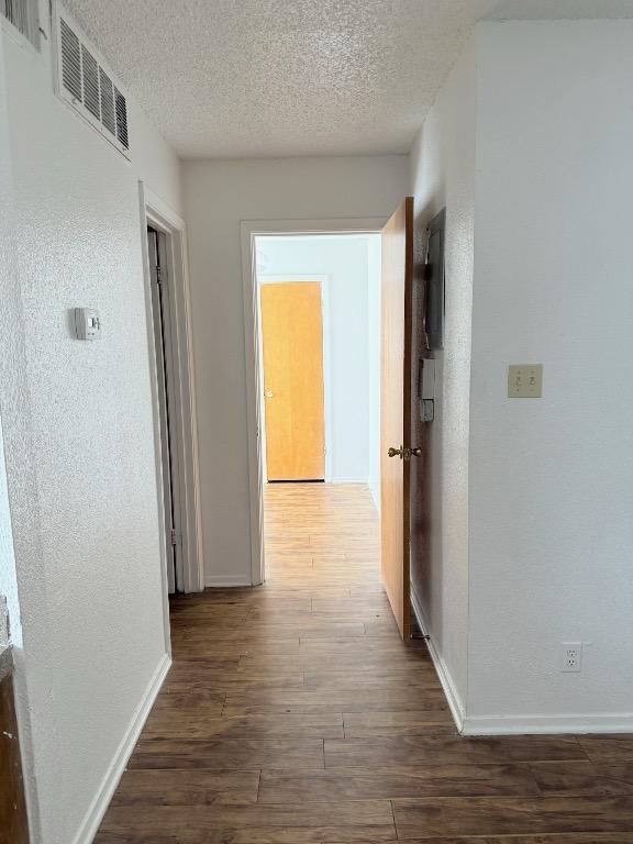 2803 Hemphill Park Unit B209, Austin, TX 78705 - corridor featuring wood finished floors and a textured ceiling
