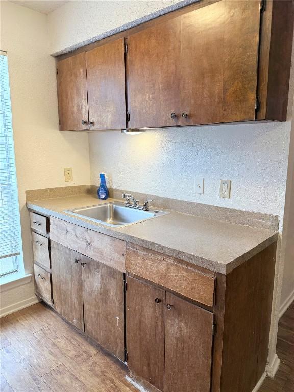 2803 Hemphill Park Unit B209, Austin, TX 78705 - kitchen with light wood-type flooring and light countertops
