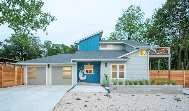 6613 Woodrow Ave, Austin, TX 78757 - view of front of property featuring concrete driveway, a garage, roof with shingles, and board and batten siding
