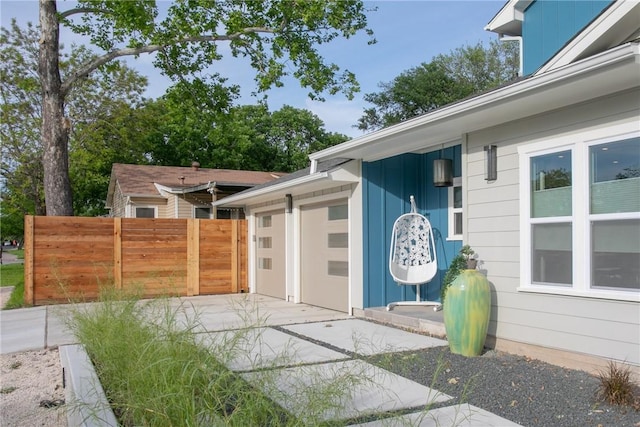 6613 Woodrow Ave, Austin, TX 78757 - view of exterior entry featuring concrete driveway and an attached garage