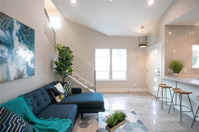 6613 Woodrow Ave, Austin, TX 78757 - living room with stairway, healthy amount of natural light, recessed lighting, light tile patterned flooring, and lofted ceiling