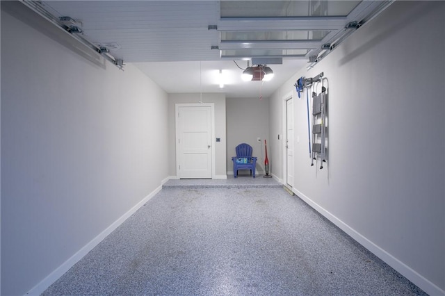 6613 Woodrow Ave, Austin, TX 78757 - garage featuring baseboards and a garage door opener