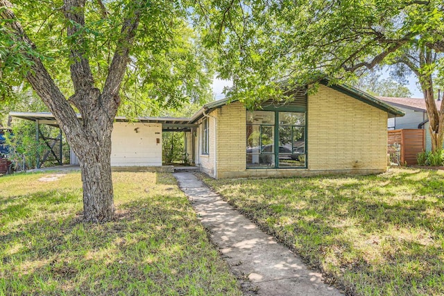 1611 Suffolk Dr, Austin, TX 78723 - mid-century inspired home featuring a front yard and a carport