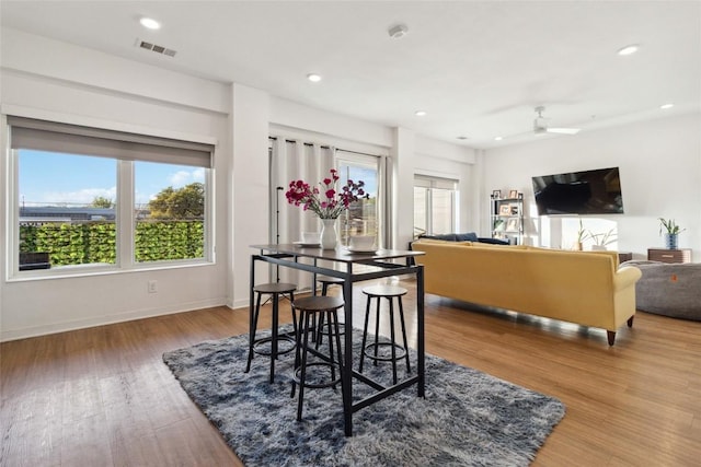 4361 S Congress Ave Unit 209, Austin, TX 78745 - dining room featuring plenty of natural light, wood finished floors, ceiling fan, and recessed lighting