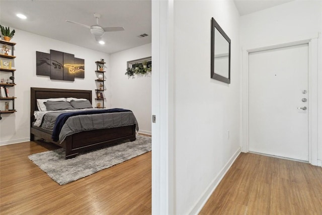 4361 S Congress Ave Unit 209, Austin, TX 78745 - bedroom with wood finished floors, recessed lighting, and ceiling fan