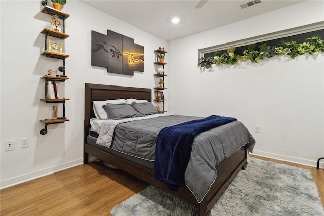4361 S Congress Ave Unit 209, Austin, TX 78745 - bedroom with wood finished floors, recessed lighting, and a ceiling fan