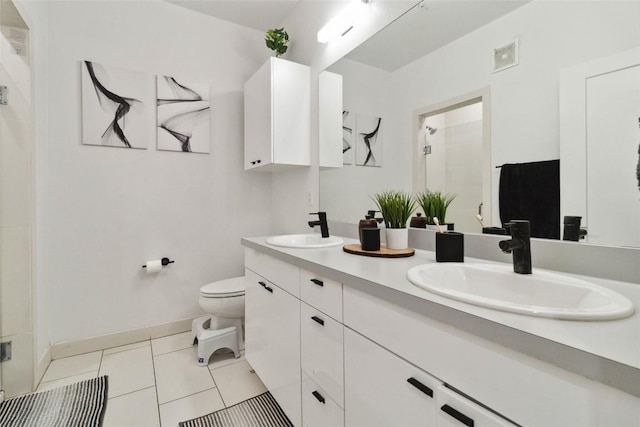 4361 S Congress Ave Unit 209, Austin, TX 78745 - full bath with double vanity, an enclosed shower, and tile patterned floors