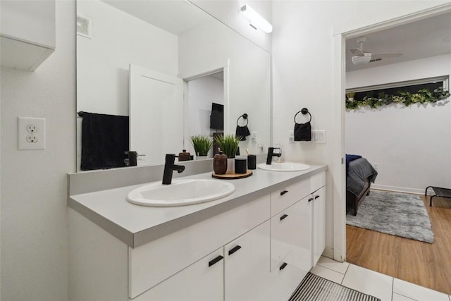 4361 S Congress Ave Unit 209, Austin, TX 78745 - ensuite bathroom featuring double vanity and wood finished floors