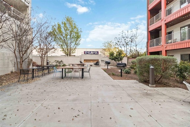 4361 S Congress Ave Unit 209, Austin, TX 78745 - view of property's community featuring outdoor dining area and a patio