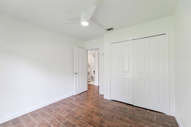 2518 Carlow Dr, Austin, TX 78745 - unfurnished bedroom with dark wood-style flooring, a closet, and a ceiling fan