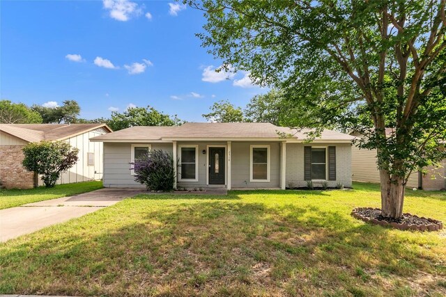 2518 Carlow Dr, Austin, TX 78745 - ranch-style house with a front lawn and brick siding