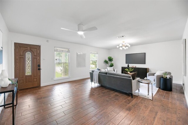 2518 Carlow Dr, Austin, TX 78745 - living area featuring wood finished floors, ceiling fan, and a chandelier