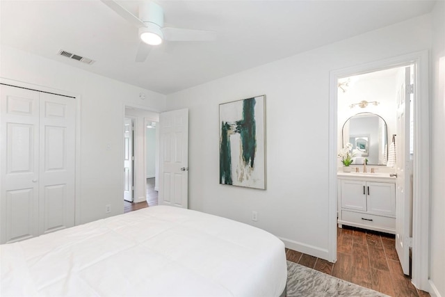 2518 Carlow Dr, Austin, TX 78745 - bedroom with dark wood finished floors, a closet, ensuite bath, and ceiling fan