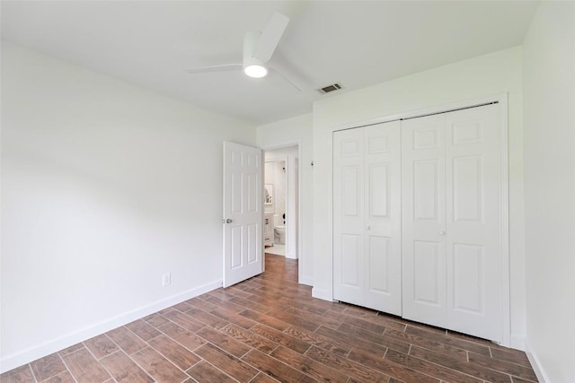2518 Carlow Dr, Austin, TX 78745 - unfurnished bedroom with dark wood-style flooring, a closet, and a ceiling fan