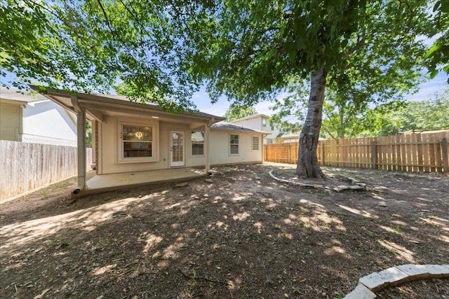 2306 Billy Fiske Ln, Austin, TX 78748 - rear view of house with a fenced backyard and a patio area