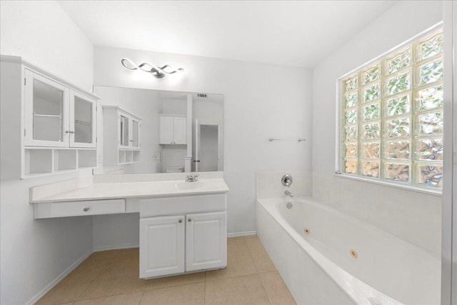2306 Billy Fiske Ln, Austin, TX 78748 - bathroom with a whirlpool tub, vanity, and tile patterned flooring