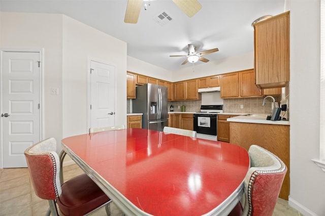 803 N Myrtle St, Georgetown, TX 78626 - kitchen with range, stainless steel refrigerator with ice dispenser, ceiling fan, and under cabinet range hood