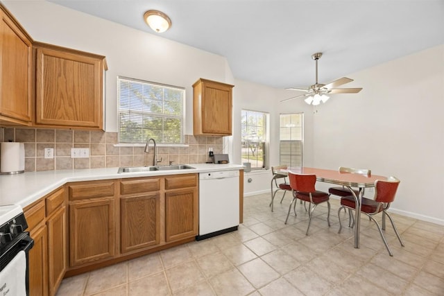 803 N Myrtle St, Georgetown, TX 78626 - kitchen with white dishwasher, electric range oven, backsplash, and brown cabinets