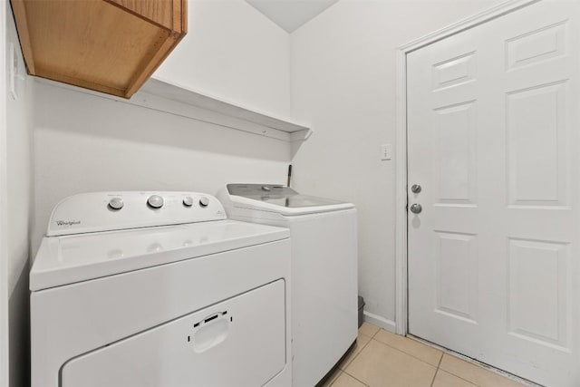803 N Myrtle St, Georgetown, TX 78626 - laundry area featuring washing machine and dryer and light tile patterned floors