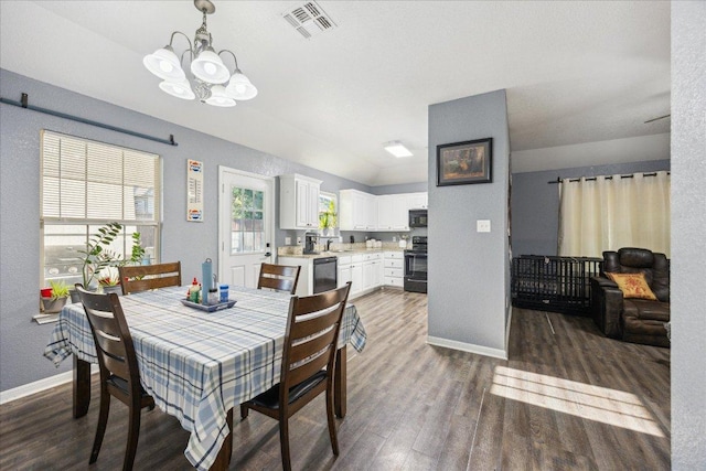 1220 Redstone Dr, Temple, TX 76502 - dining space featuring a chandelier, dark wood-type flooring, and vaulted ceiling