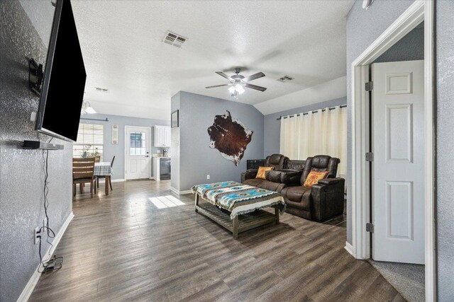 1220 Redstone Dr, Temple, TX 76502 - living room with ceiling fan, dark wood finished floors, and a textured ceiling