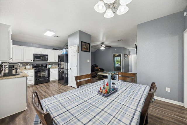 1220 Redstone Dr, Temple, TX 76502 - dining space with dark wood-type flooring, a chandelier, and a ceiling fan