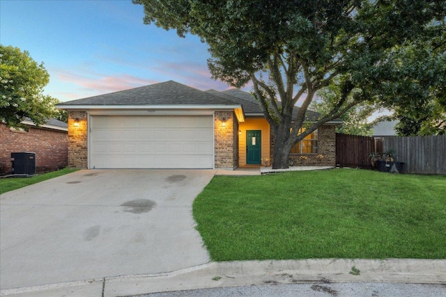 1220 Redstone Dr, Temple, TX 76502 - view of front of home featuring an attached garage, concrete driveway, brick siding, and a shingled roof