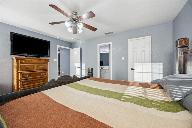 1220 Redstone Dr, Temple, TX 76502 - bedroom featuring connected bathroom, ceiling fan, and wood finished floors