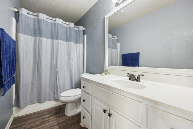 1220 Redstone Dr, Temple, TX 76502 - full bath featuring wood finished floors, vanity, and a textured wall
