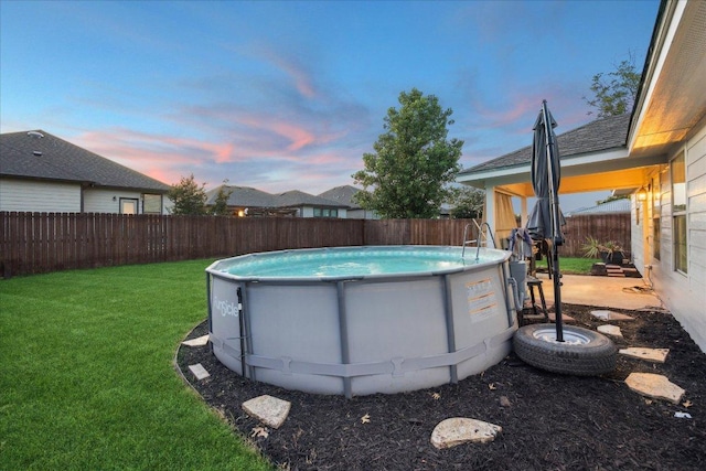 1220 Redstone Dr, Temple, TX 76502 - pool at dusk with a fenced backyard
