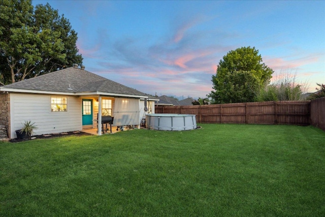1220 Redstone Dr, Temple, TX 76502 - back of property with a fenced backyard and roof with shingles