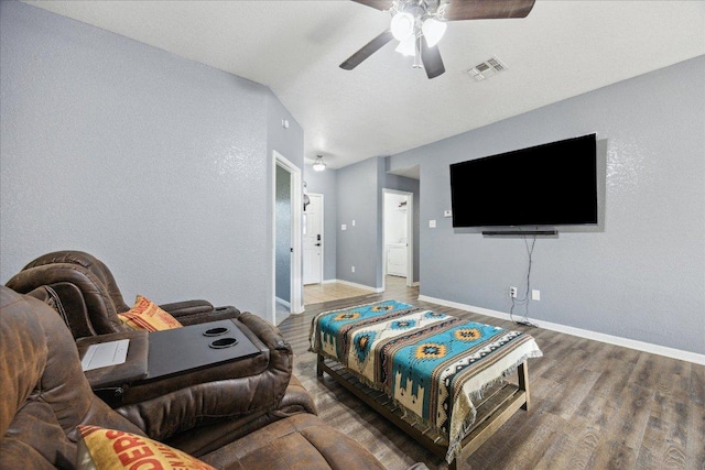 1220 Redstone Dr, Temple, TX 76502 - living area with wood finished floors, ceiling fan, and vaulted ceiling