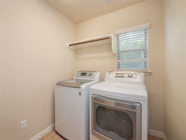 457 Monahans Dr, Georgetown, TX 78628 - washroom with washing machine and dryer and baseboards