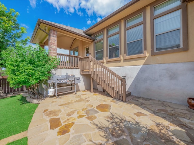 457 Monahans Dr, Georgetown, TX 78628 - doorway to property with a patio and stucco siding
