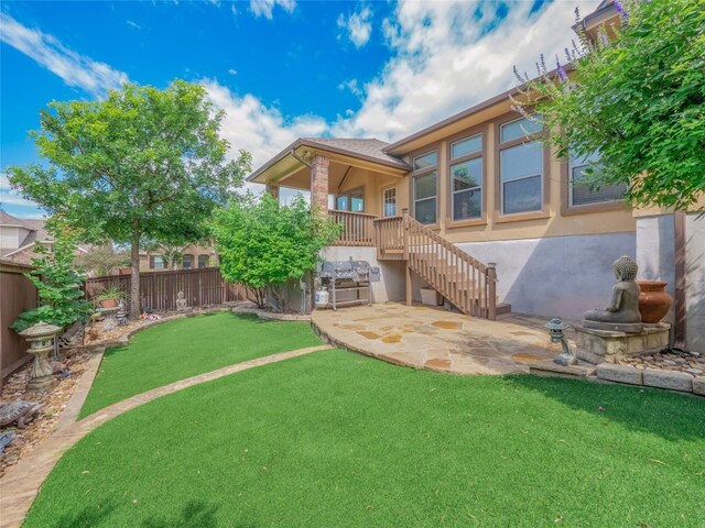 457 Monahans Dr, Georgetown, TX 78628 - back of property featuring stucco siding, a fenced backyard, and a patio
