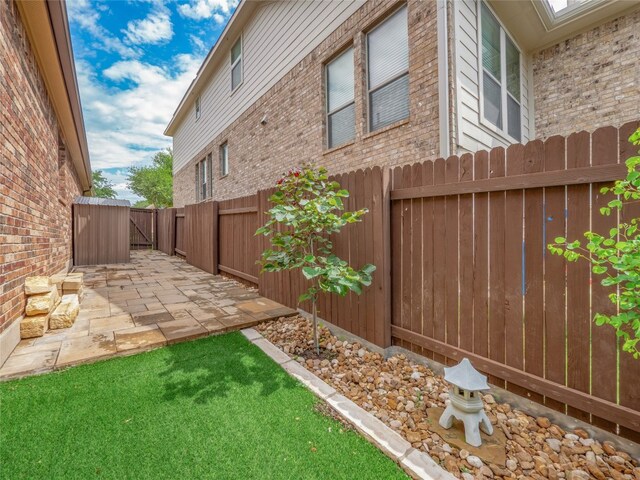 457 Monahans Dr, Georgetown, TX 78628 - fenced backyard with a patio area and a gate